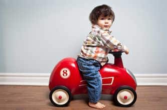 Toddler in toy car