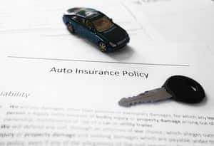 A car insurance policy with a toy car